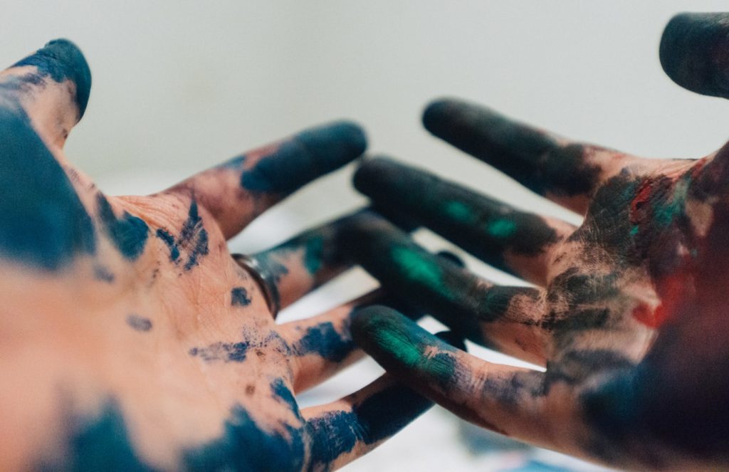 dirty hands covered in paint