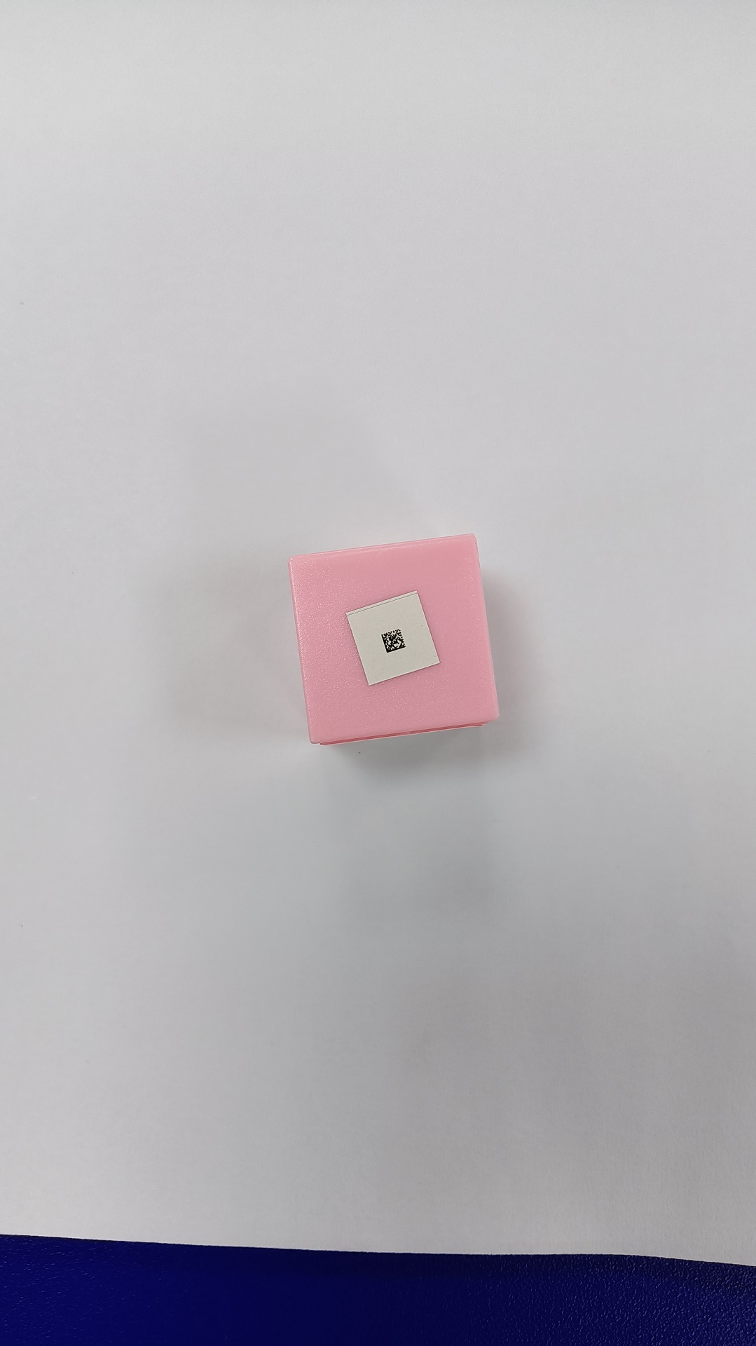 a 2 mm x 2 mm tiny DataMatrix code with white background